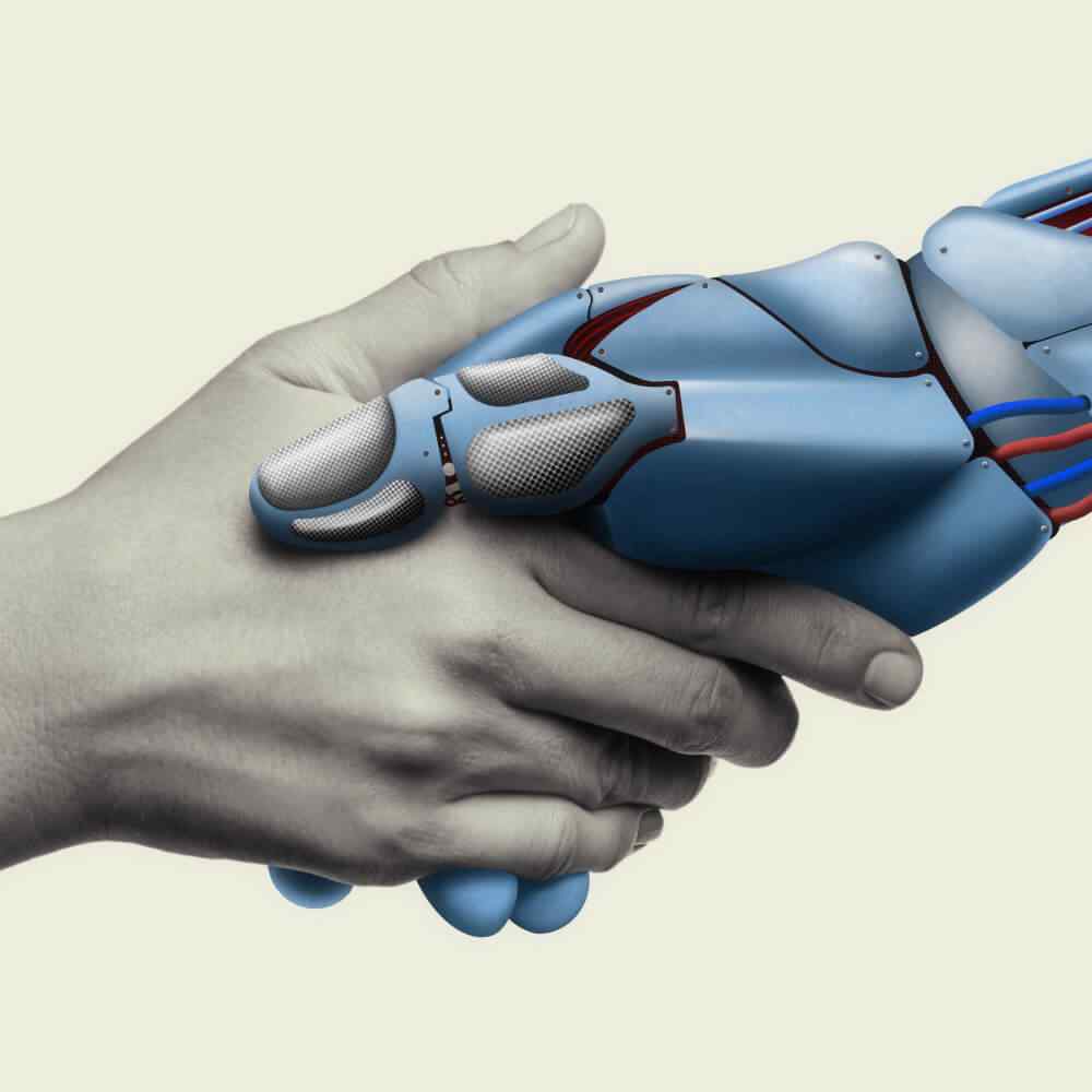 Human hand shaking a robotic hand