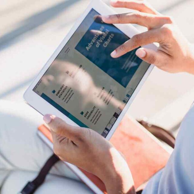 Hands holding a tablet